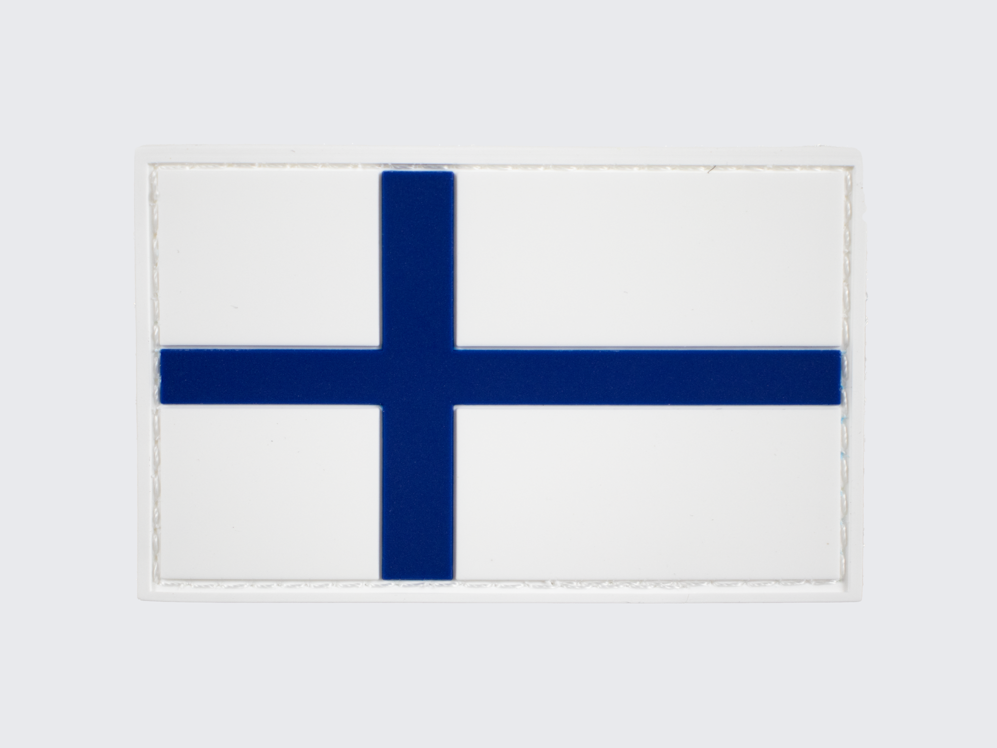 PVC hihamerkki Suomen lippu. Blå och vit finska flagga PVC ärmmärke. Blue and white Finnish flag PVC moral patch.